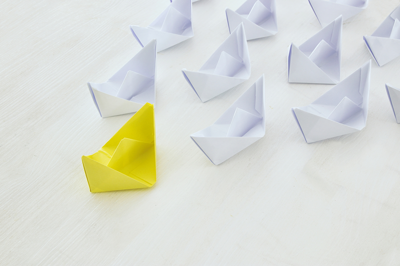 leadership concept, paper boat leading followers